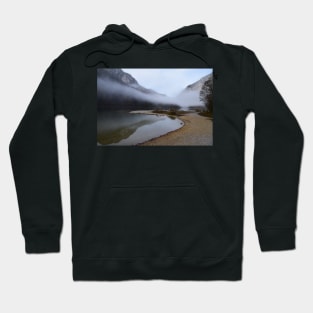 The fog clears at the lake in autumn Hoodie